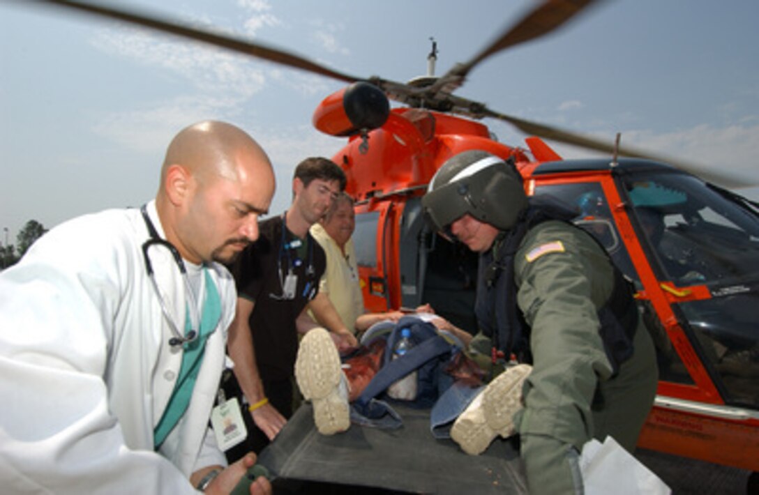 Hospital Personnel Offload An Simulated Patient On A Stretcher