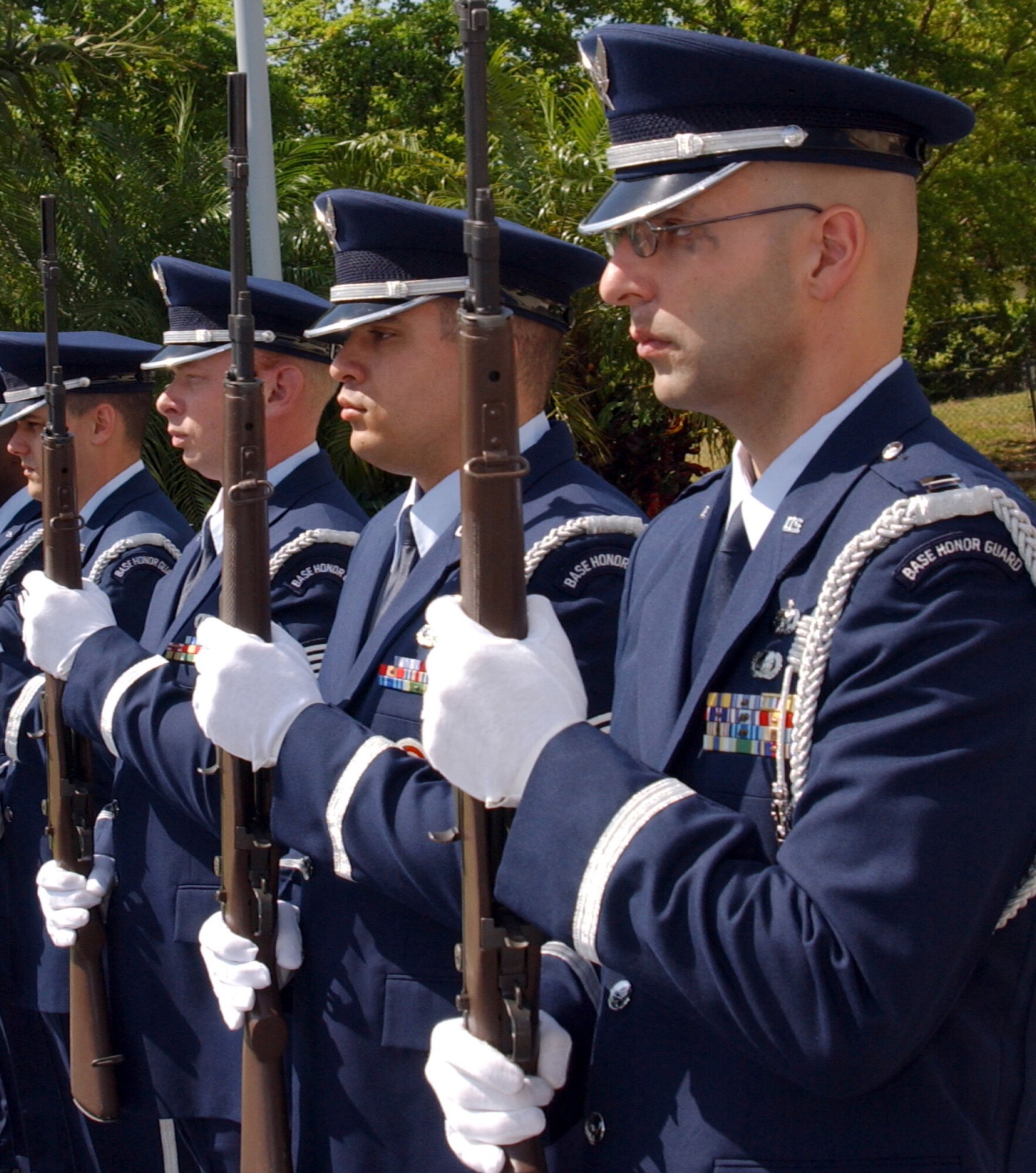 HOMESTEAD AIR RESERVE BASE, Fla. -- (From front) Capt. Paul Hubenthal and Staff Sgts. Leo Castellano, Ryan Ayers and Luis Pacheco take part in a military ceremony.  The honor guard here performs military funeral honors for veterans throughout South Florida.  (U.S. Air Force photo by Jake Shaw)