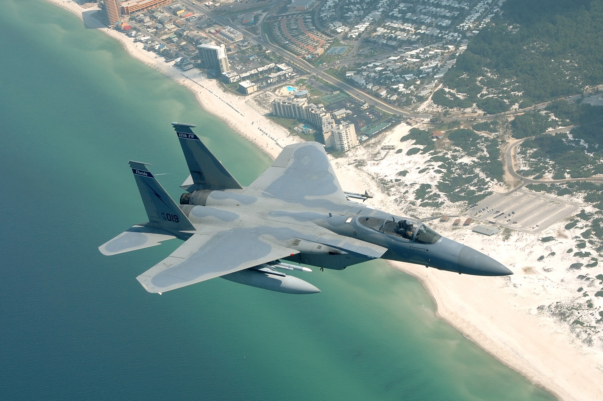 OVER PANAMA CITY, Fla. -- An F-15 Eagle flys over the  beach on approach to Tyndall Air Force Base, Fla., after a mission during a weapons systems evaluation program sortie May 19. The Eagle is assigned to the Florida Air National Guard's 125th Fighter Wing. (U.S. Air Force photo by Master Sgt. Shaun Withers)