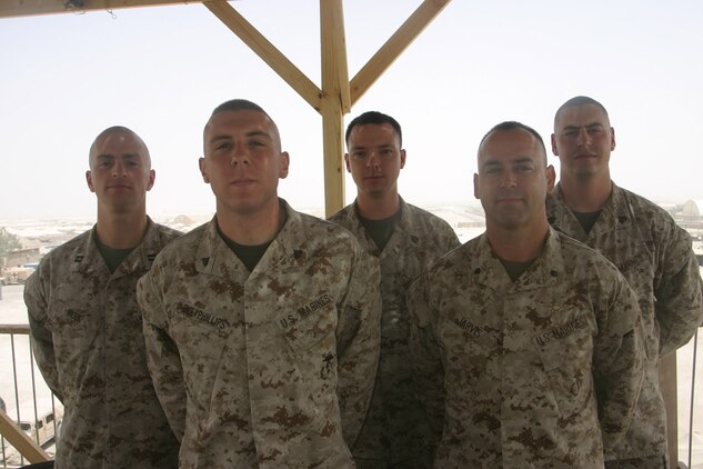 AL TAQADDUM, Iraq ? The Al Taqaddum air boss shop, (back row L-R) Capt. Donald Meek, assistant air boss; Staff Sgt. Dick Maxie, the flight clearance staff noncommissioned officer; Sgt. Nicholas Breidenger, the air boss chief. (front row L-R) Cpl. Anthony Riley, air boss clerk and Lt. Col. Allan Jarvis, air boss; are responsible for all flight operations in and out of Al Taqaddum. The air boss Marines have coordinated 167 CASEVAC missions, transferring more than 270 patients in their three months here.