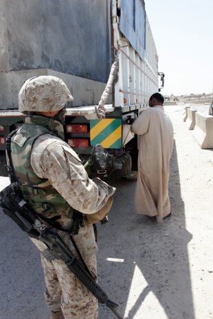 Carlsbad, N.M. native Cpl. Justin R. Molgaard, a disburser with Service Company, Headquarters and Support Battalion, 2nd Force Service Support Group (FWD) likes his job.  He not only gives Marines split and casual payments at the dam, but he takes trips with 5th Civil Affairs Group, II Marine Expeditionary Force (FWD) often.  Molgaard thinks the 5th CAG makes a lasting impression on the locals in Iraq.