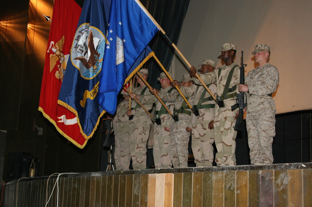AL ASAD, Iraq - Members of the Al Asad joint service color guard post the colors during the Memorial Day services here, May 30. The Memorial Day service also included guest speakers from representing every service aboard the base.