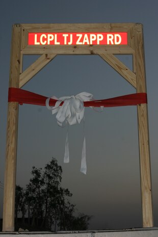 CAMP TAQADDUM, Iraq (May 30, 2005) - As a way to honor those who have made the ultimate sacrifice, Combat Logistics Regiment 25, 2d Force Service Support Group (Forward), had a road dedication service and 5 kilometer memorial run to celebrate the life of Lance Cpl. Thomas J. Zapp, the first Marine with 2d Supply Battalion to lose his life during Operation Iraqi Freedom. Memorial Day is a day to honor the thousands who have lost their lives in the name of freedom, and that is just what the service members here did May 30.