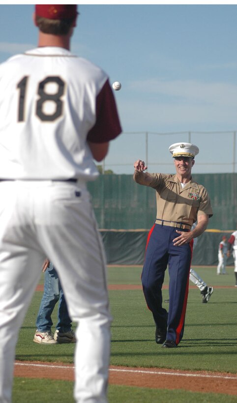 Lt. Col. Mark P. Everman, commanding officer, Marine Attack Squadron-214, and other supporters of the Yuma Scorpions, had the unique opportunity to line up and throw the first pitches of the game at the Desert Sun Stadium May 30. Because the game was on Memorial Day, the Scorpions honored service members of the past and present by involving them in various parts of the game.