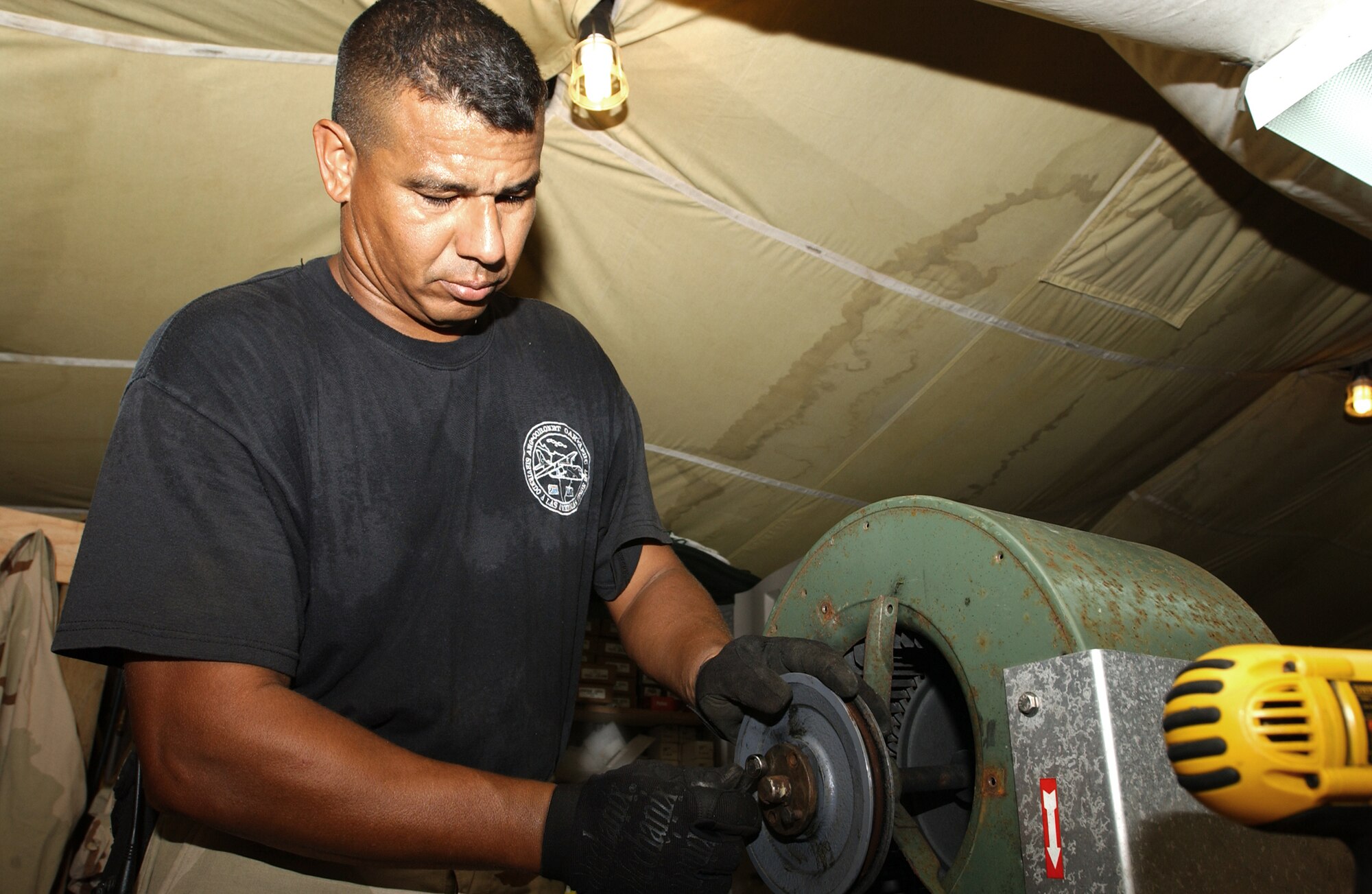 OPERATION ENDURING FREEDOM -- Master Sgt. Alex Gonzalez repairs an environmental control unit used to cool tents at a forward-deployed location.  He is the 40th Expeditionary Civil Engineer Squadron's heating, ventilation, air conditioning and refrigeration flight superintendent and is deployed from Muniz Air National Guard Base, Puerto Rico.  (U.S. Air Force photo by Staff Sgt. Joceyln Rich)