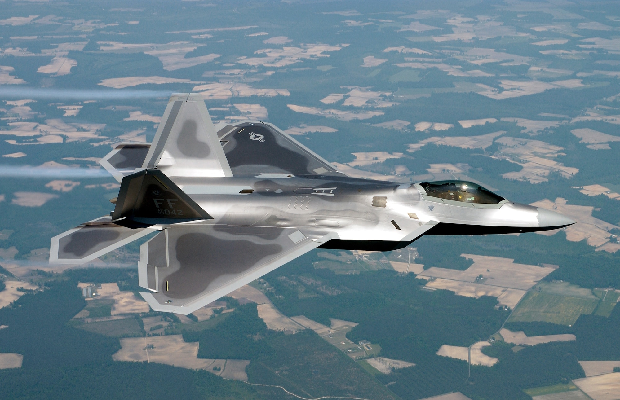 OVER VIRGINIA  --  Lt. Col. James Hecker delivers the first operational F/A-22 Raptor to its permanent home at Langley Air Force Base, Va. Tail number 3042 marks the first of 26 Raptors to be delivered to the 27th Fighter Squadron.  (U.S. Air Force photo by Tech. Sgt. Ben Bloker) 

