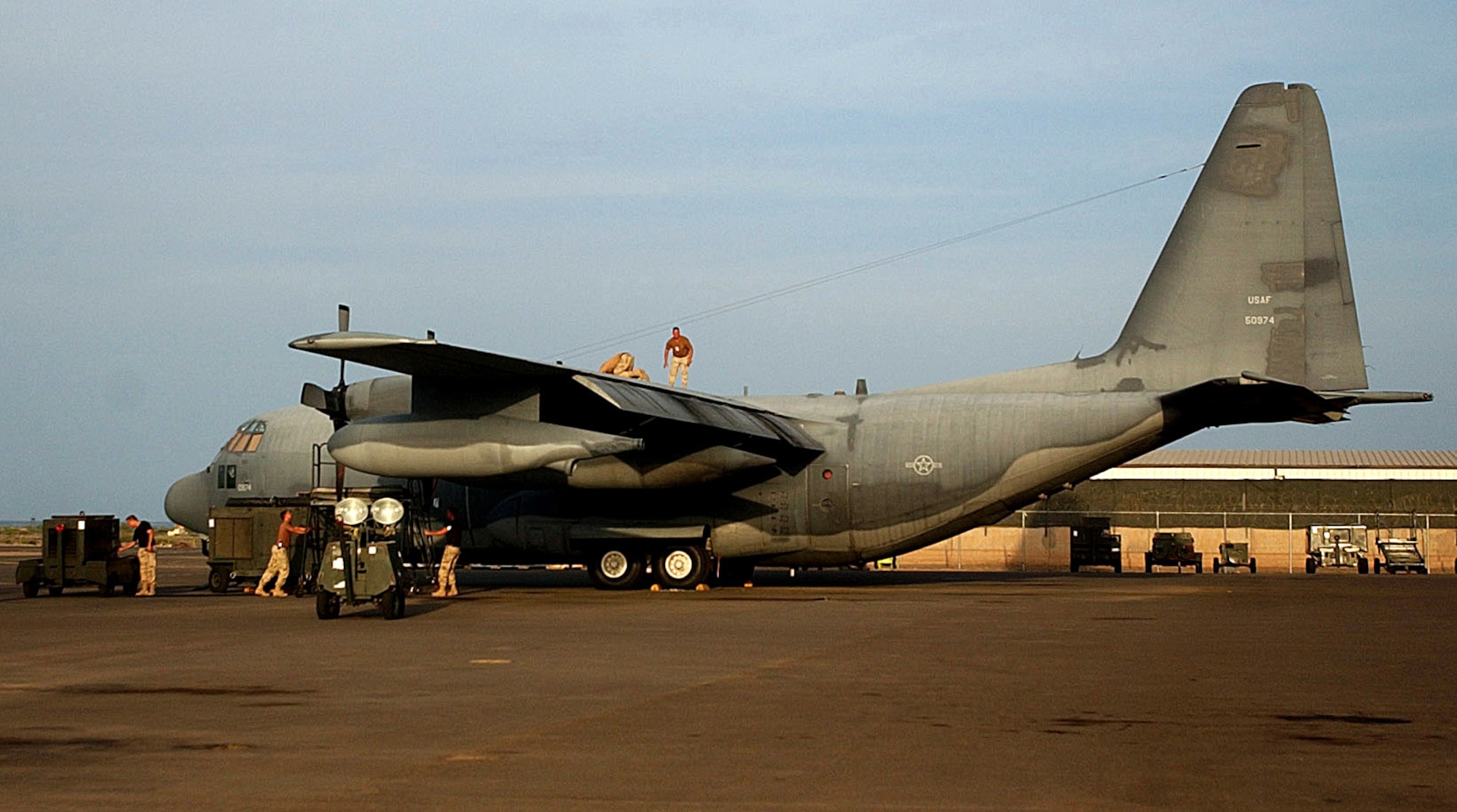 DJIBOUTI, Africa (AFPN) -- Airmen from the 449th Expeditionary Rescue Squadron prepare an HC-130 for a Combined Task Force-Horn of Africa mission. The New York Air National Guardsmen are from the 102nd Rescue Squadron, the oldest ANG unit. While deployed to Djibouti, Africa, the unit performed pararescue drops, air refueling for Marine CH-53s and stayed on alert, ready to recover any downed servicemembers. (U.S. Air Force photo by 2nd Lt. Shannon Collins) 