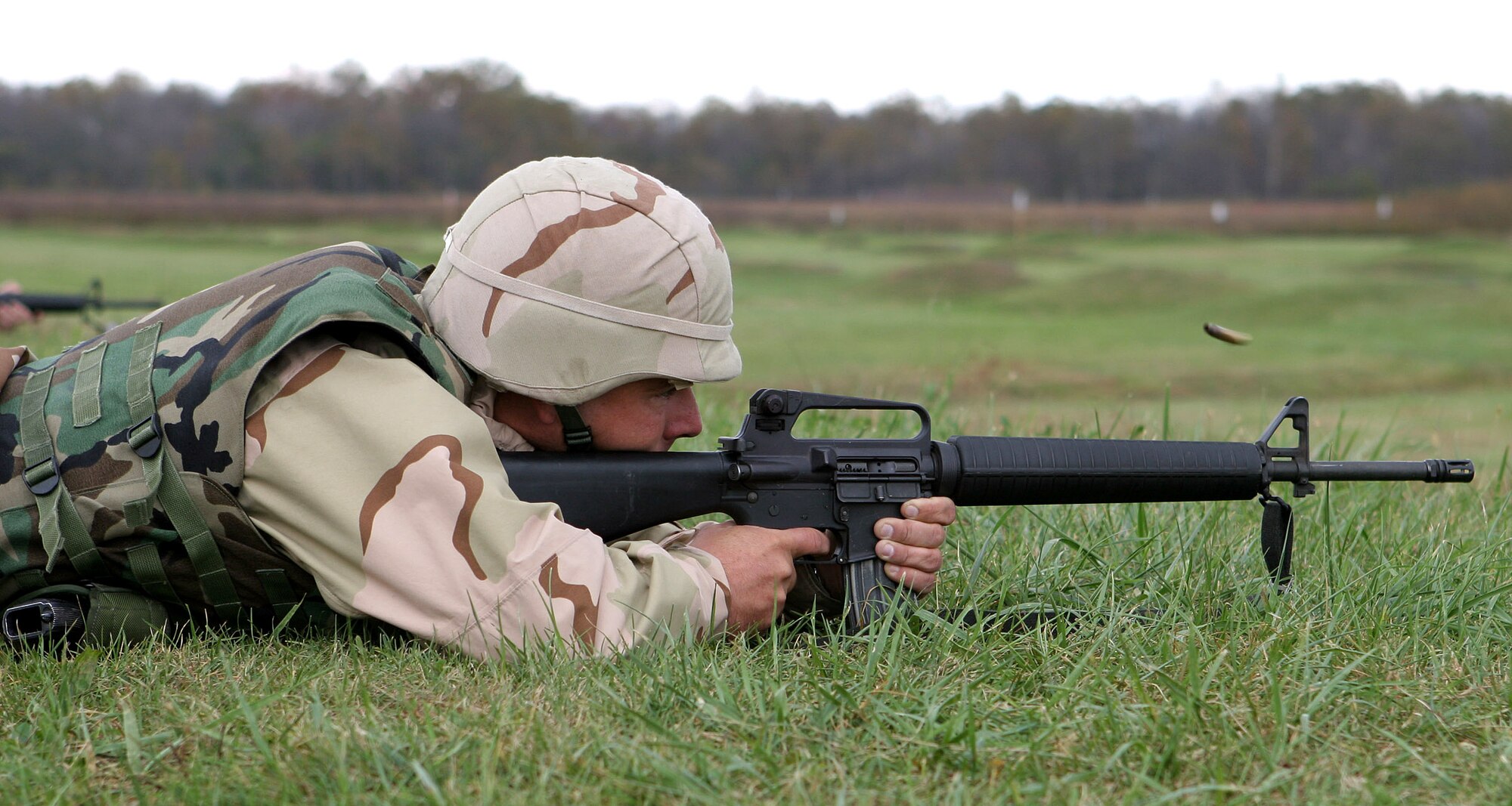 CAMP ATTERBURY, Ind. (AFPN) -- Tech Sgt. Steven Halloway, a vehicle maintenance repairman with 18th Logistics Readiness Squadron, fires his M-16 rifle during marksmanship training Oct. 26.  (U.S. Army photo by Army Sgt. Jeff Lowry)