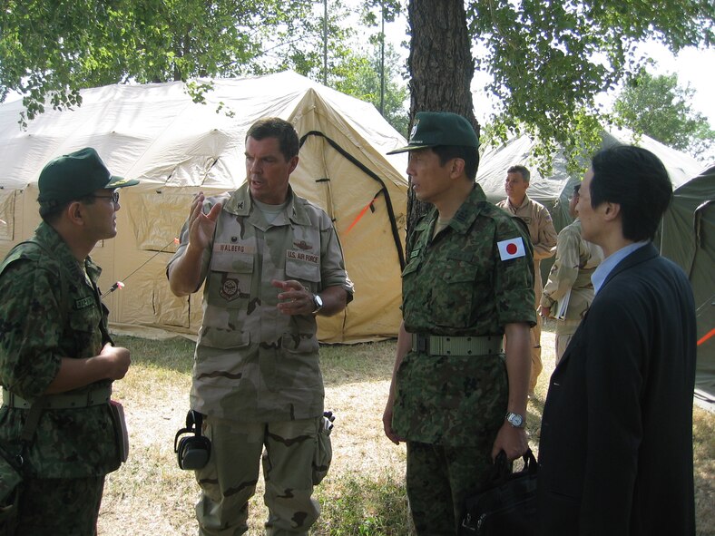 ISLAMABAD, PAKISTAN (AMCNS) – Col. Richard Walberg, 818th Contingency Response Group commander, speaks with members of the Japanese humanitarian support team here. The 818th CRG deployed to Pakistan from McGuire Air Force Base, N.J., to accept and help distribute U.S. humanitarian aid sent to the country following the recent earthquake. (Photo by 1ST Lt. Erick Saks)