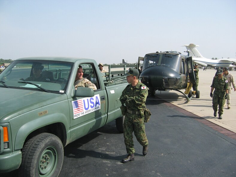 PAKISTAN (AMCNS) – Tech. Sgt Jeff Mitchell, an 818th Contingency Response Group member, tows a Japanese UH-1 here. Japan is one of more than 20 nations that has provided support following the earthquake in Pakistan. The 818th CRG deployed to Pakistan from McGuire Air Force Base, N.J., to accept and help distribute U.S. humanitarian aid sent to the country following the recent earthquake. (Photo by 1ST Lt. Erick Saks)