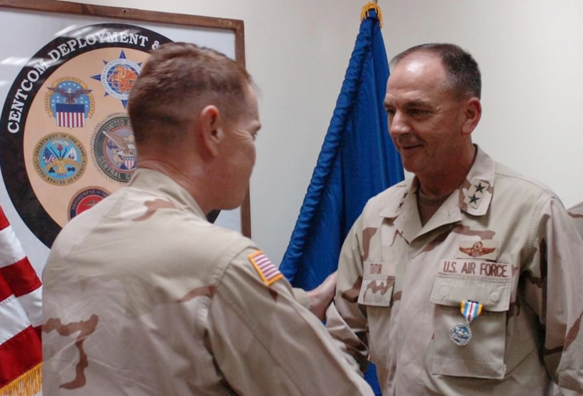 Maj. Gen. F. Dexter Tutor is presented the Defense Superior Service Medal for his exceptional service and accomplishments during his tour of active duty in support of Operation Iraqi Freedom.  General Tutor is a Tennessee Air National Guard officer and Air National Guard assistant to the AMC commander.