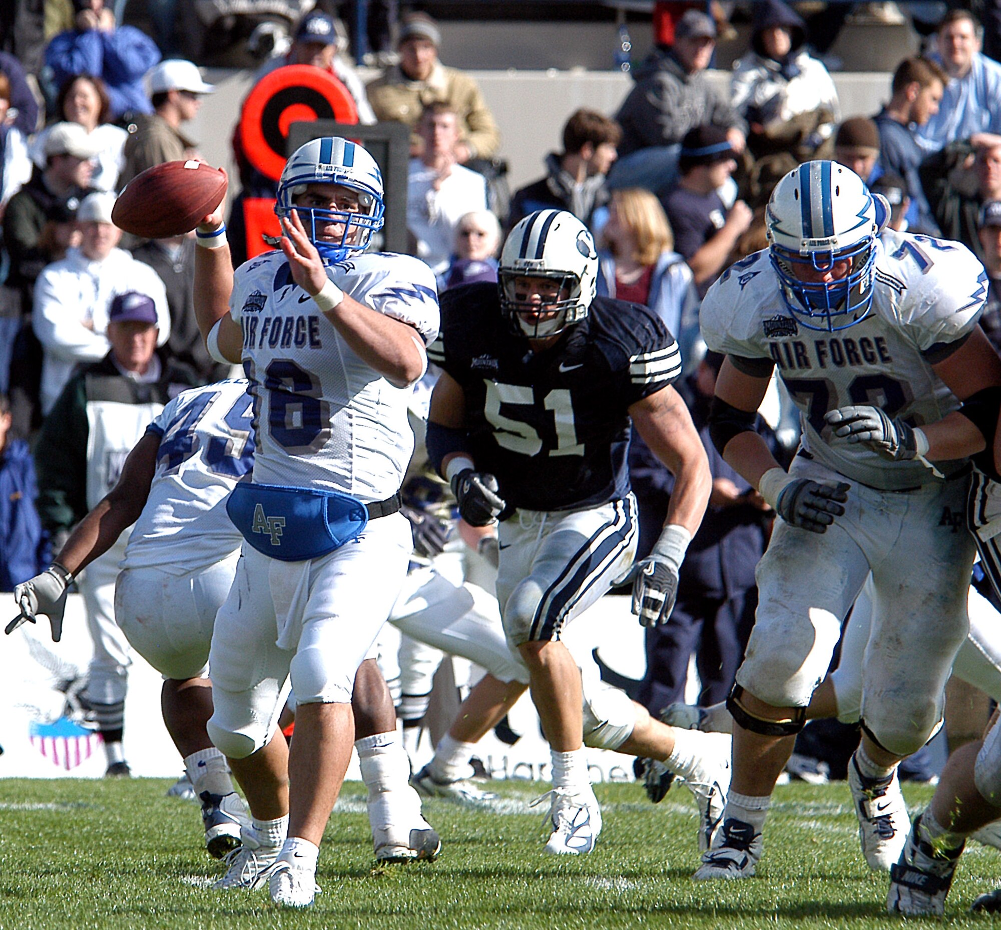 PROVO, Utah -- Senior quarterback Adam Fitch looks for a receiver along the sidelines Oct. 29 during the Falcon's 62-41 loss to Brigham Young University. Fitch, who entered the game after an injury to starting quarterback Shaun Carney, threw for five touchdowns in setting an academy record.  Air Force closes out the home portion of its season Nov. 5 against Army. (U.S. Air Force photo by John Van Winkle)
