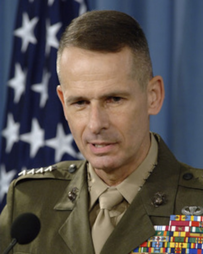 Chairman of the Joint Chiefs of Staff Gen. Peter Pace, U.S. Marine Corps, responds to a reporter's question during a press briefing with Secretary of Defense Donald H. Rumsfeld in the Pentagon on Nov. 1, 2005. Pace and Rumsfeld updated reporters on current operations. The press conference was the first for Pace since being sworn in as the 16th Chairman of the Joint Chiefs of Staff in September. 
