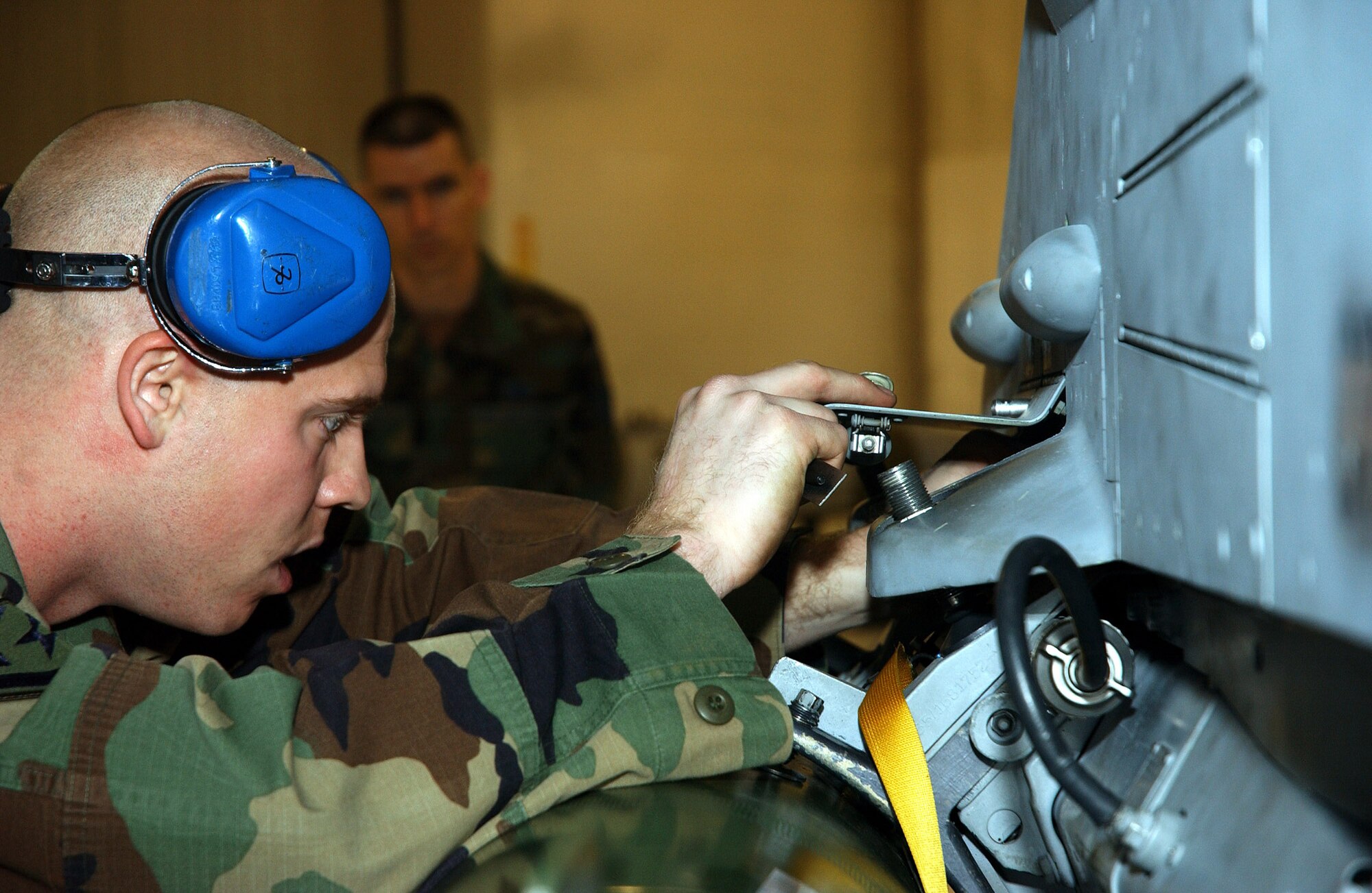 EIELSON AIR FORCE, Alaska (AFPN) -- Staff Sgt. Aaron Slay checks a pin during a quarterly load crew competition here.  Each team of F-16 Fighting Falcon and A-10 Thunderbolt II weapon loaders is evaluated in timeliness and accuracy of loading munitions. Sergeant Slay is a weapons crew chief assigned to the 354th Aircraft Maintenance Squadron (U.S. Air Force photo by Airman 1st Class Anthony Nelson Jr.) 