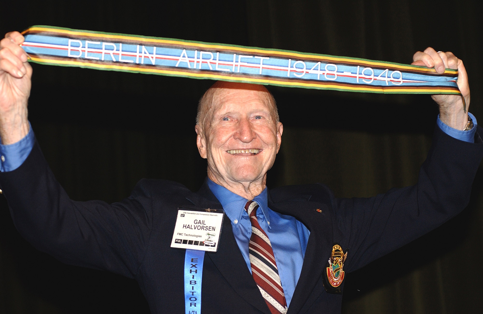 NASHVILLE, Tenn. -- Retired Col. Gail Halvorsen displays the newly authorized Berlin Airlift streamer presented to him Oct. 29 here at the Airlift Tanker Association convention. Units that  participated in the 1948-1949 humanitarian airlift can include the streamer on their units' guidons. Colonel Halvorsen is known as the "Candy Bomber" for dropping candy from his aircraft to German children during the airlift. (U.S. Air Force photo)
