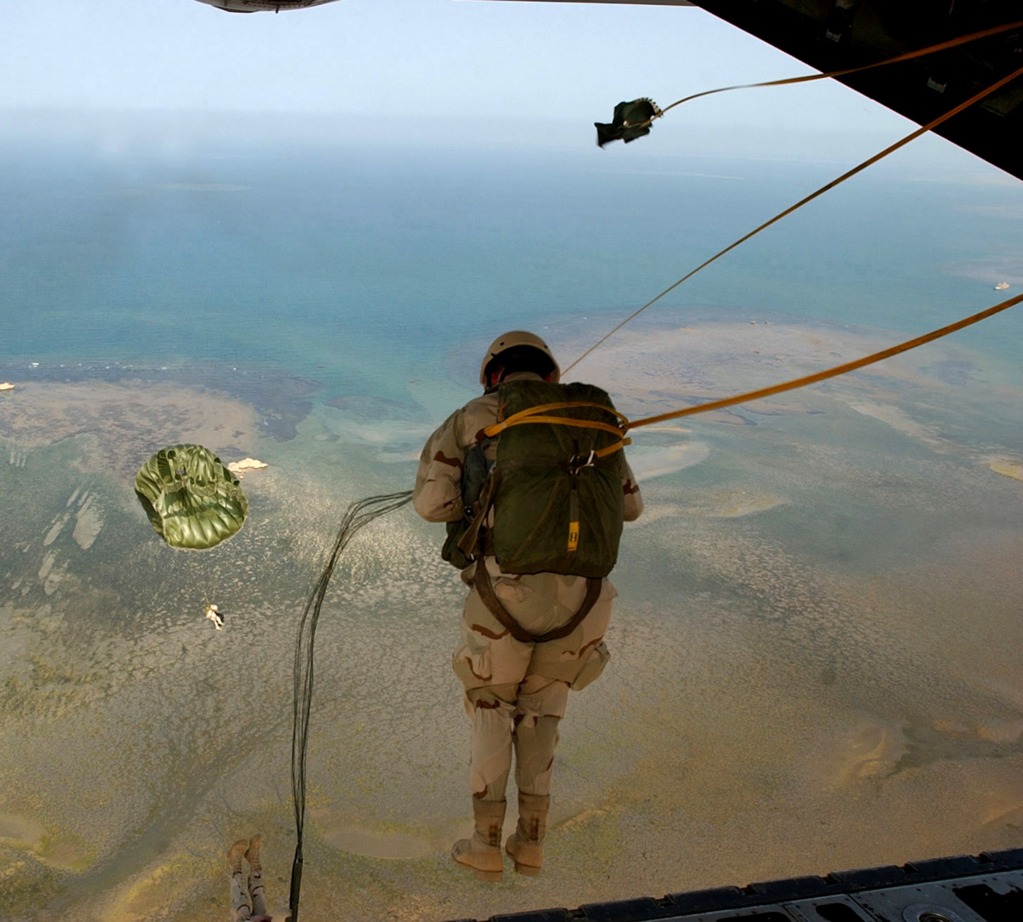 OVER AFRICA (AFPN) -- A pararescueman jumps from an HC-130 during a training mission recently. The Airman is from the 131st Rescue Squadron, which works hand in hand with the 449th Expeditionary Rescue Squadron. The training occurred while deployed in support of Combined Joint Task Force-Horn of Africa in Djibouti, Africa. (U.S. Air Force photo by 2nd Lt. Shannon Collins) 
