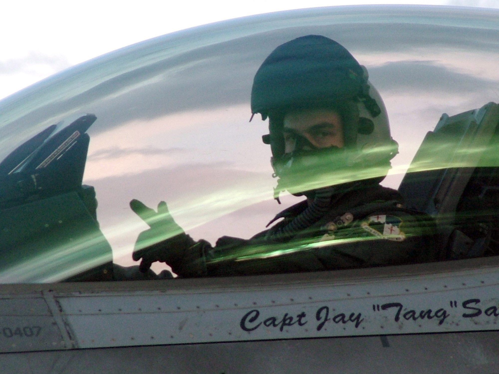 SIALULIAI, Lithuania (AFPN) -- Capt. Joey Gaona signals the completion of another successful mission here. The 23rd Expeditionary Fighter Squadron is participating in NATO's Baltic Air Policing mission, providing 24-hour security over the skies of Lithuania, Latvia and Estonia.  Captain Gaona is an F-16 Fighting Falcon pilot assigned to the 23rd Fighter Squadron at Spangdahlem Air Base, Germany. (U.S. Air Force photo by Capt. Thomas Crosson) 
