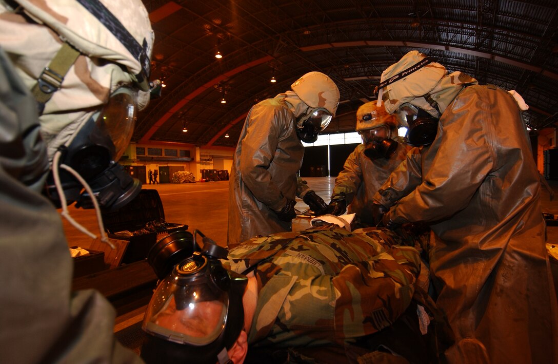 Staff Sgt. Nathan Leemen, 352nd Operation Support Squadron, medical element, is a convincing seizure patient to test the medical decontamination team for an IG inspection inject 26 Oct. 2005 during the ORI.    
