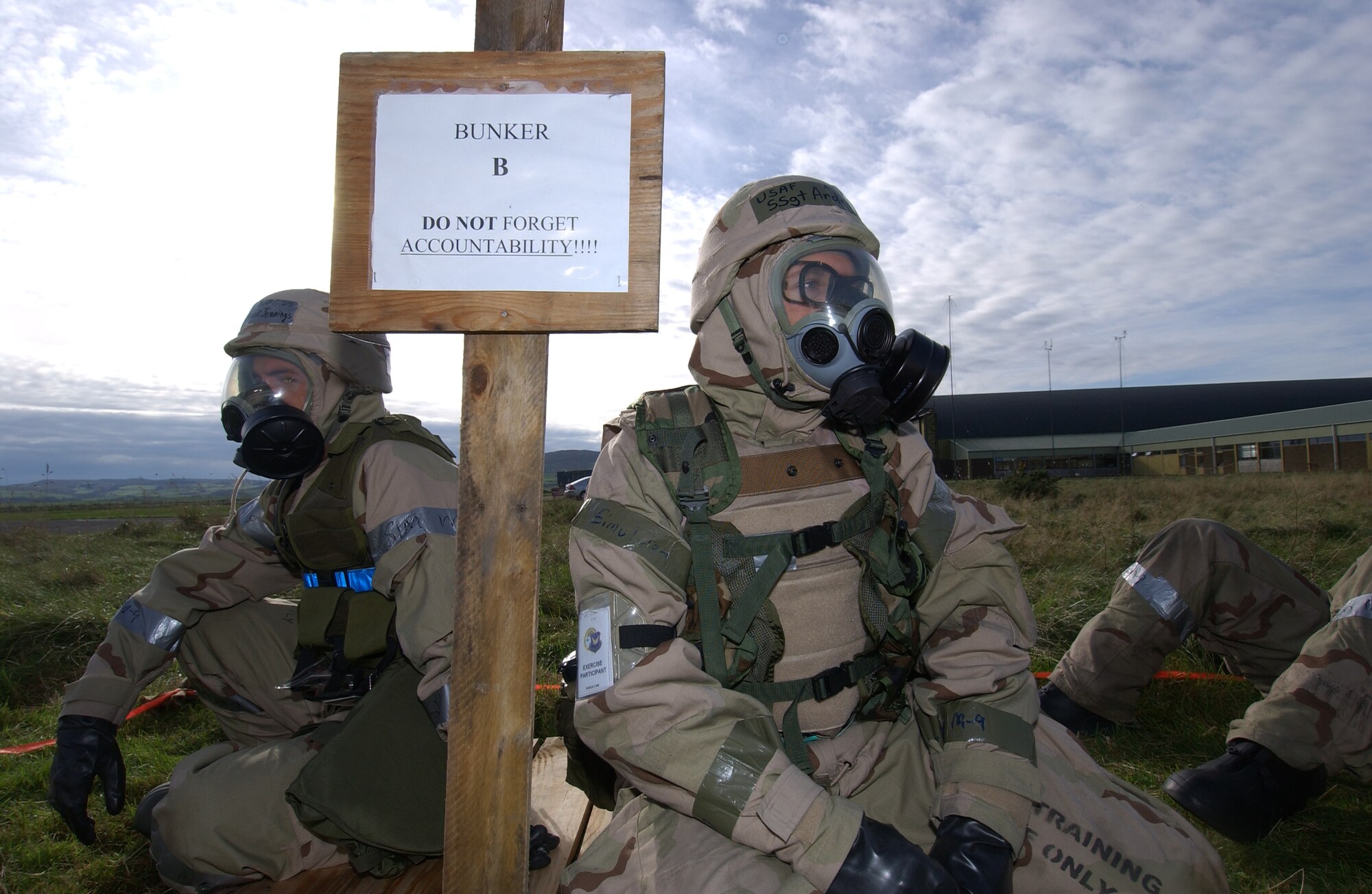 Staff Sgts. Shane Jennings and Andrew Aller, 352nd Maintenance Squadron, take cover in a simulated bunker during the Ability to Survive and Operate phase of the ORI 22 Oct. 2005.