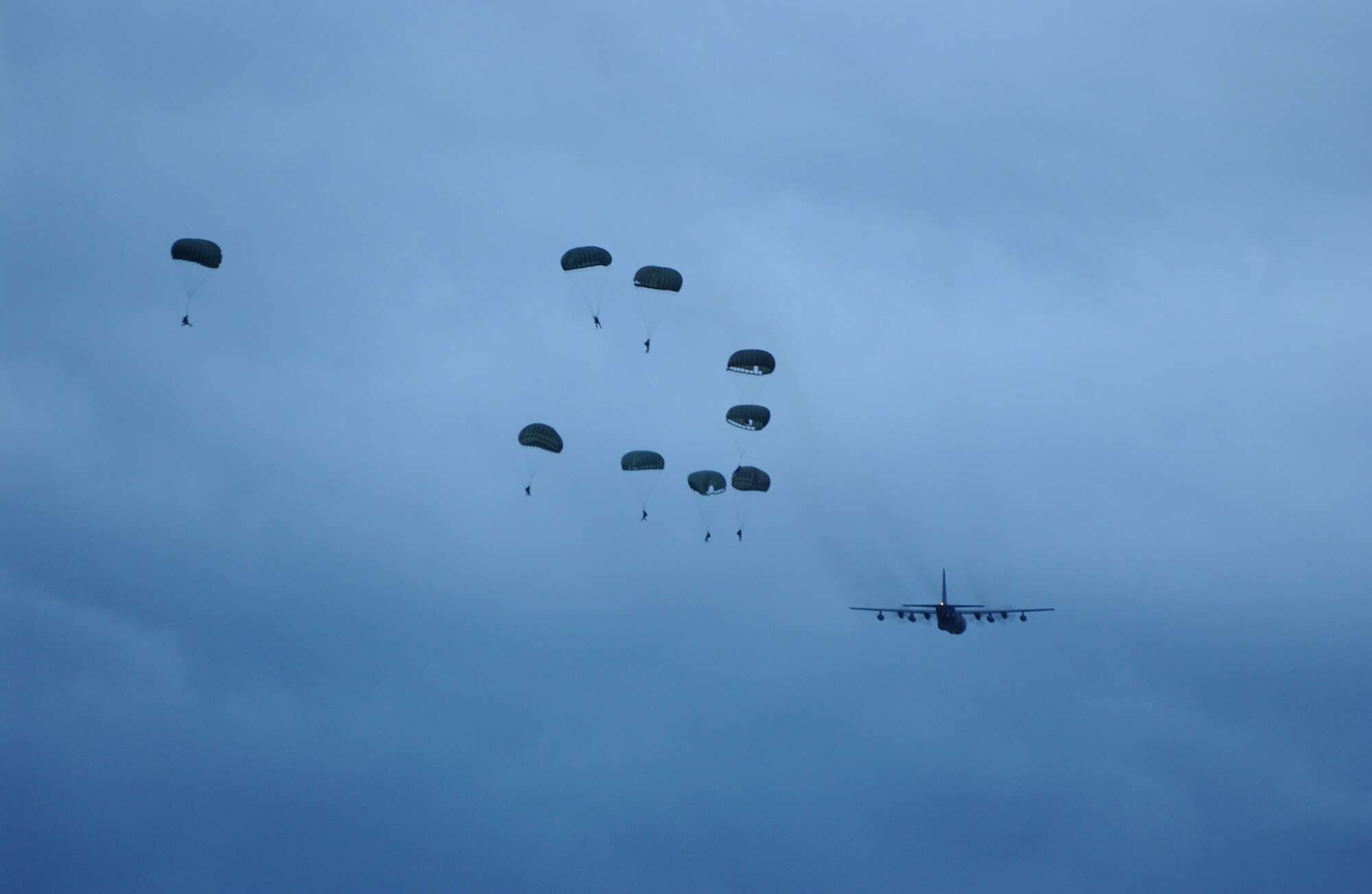 321st Combat controllers and pararescuemen bail out of the back of an MC-130 for a static line parachute jump during the inspection. 


