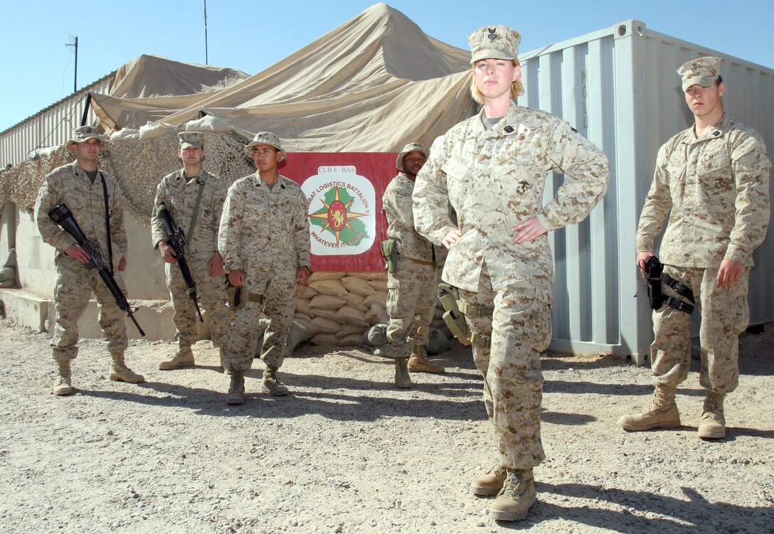 Servicemembers from the CLB-8 stand in front of the BAS facility here Nov. 3, 2005. Most of the corpsmen and Marines operating with the CLB-8 BAS are in their early 20's; yet, they are responsible for frequently treating injured Marines, sometimes seriously wounded, in combat operations.