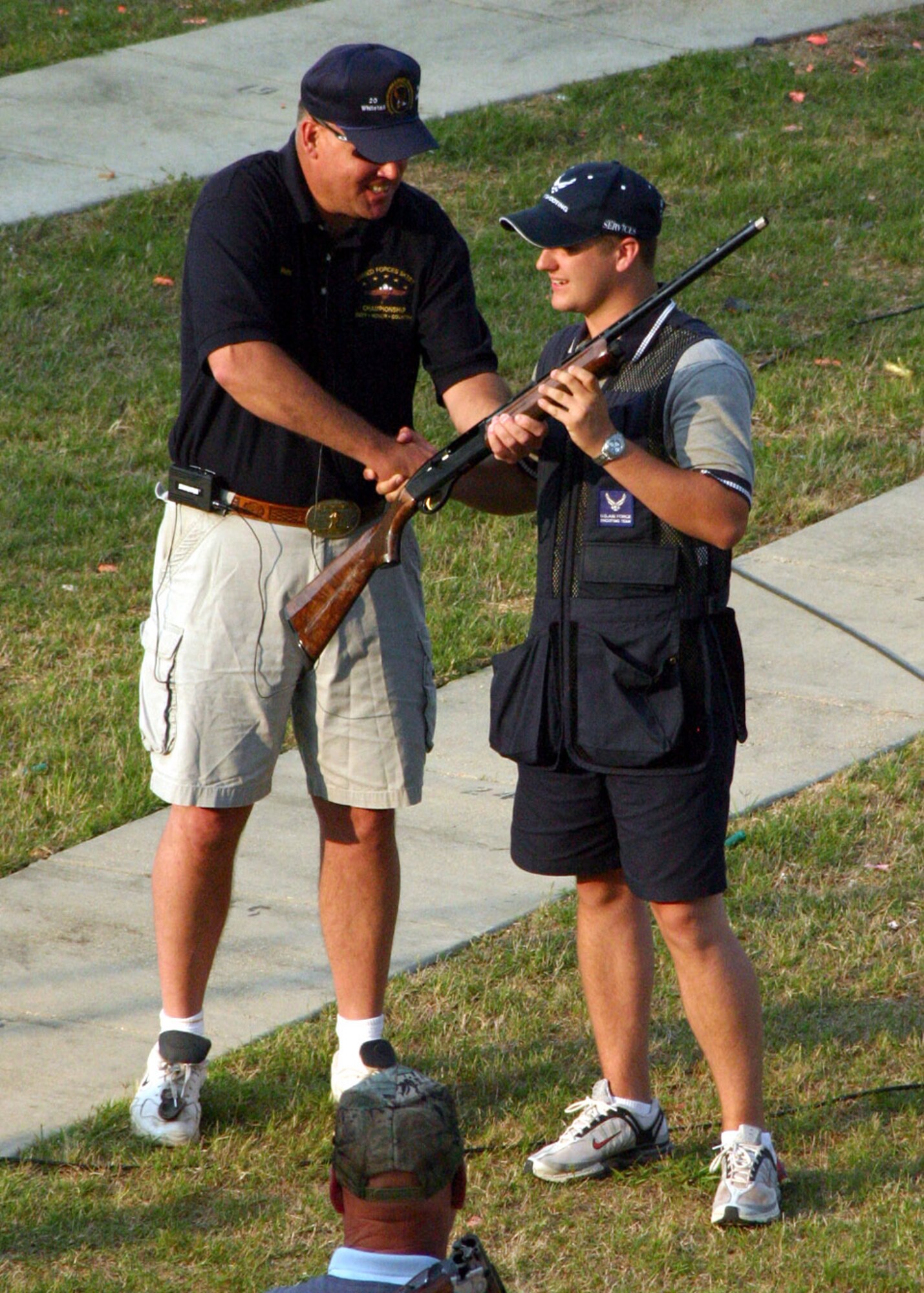 SAN ANTONIO (AFPN) -- Airman 1st Class Christopher Ashley, an Air Force Skeet Team shooter, accepts his award as the Armed Services High Overall Champion during the 2005 Armed Services Skeet Championship in May. Airman Ashley is from Davis-Monthan Air Base, Ariz. He went on to win seven more individual awards during the event. (U.S. Air Force photo) 