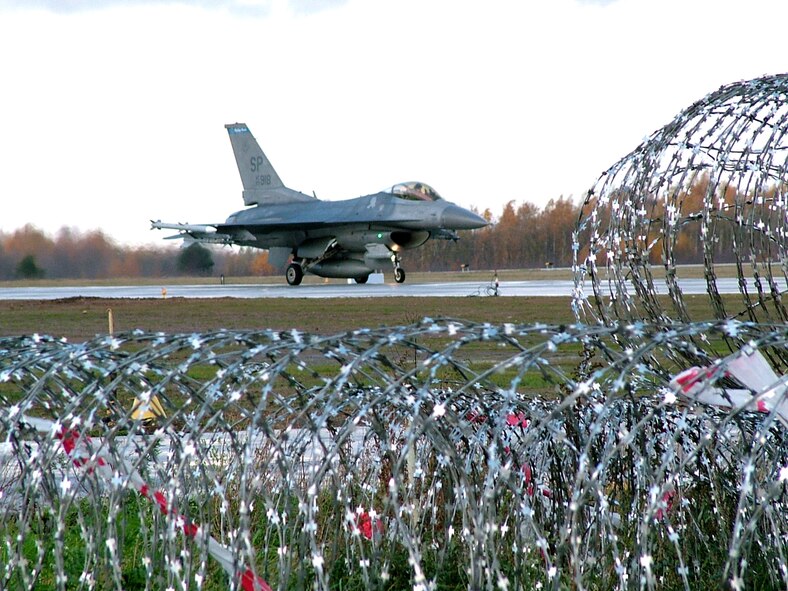 SIALULIAI, Lithuania (AFPN) -- Capt. Joey Gaona taxis along the flightline after a training flight here. Captain Gaona is a pilot assigned to the 23rd Expeditionary Fighter Squadron. The 23rd EFS is participating in NATO's Baltic Air Policing mission, providing 24-hour security over the skies of Lithuania, Latvia and Estonia. (U.S. Air Force photo by Capt. Thomas Crosson)