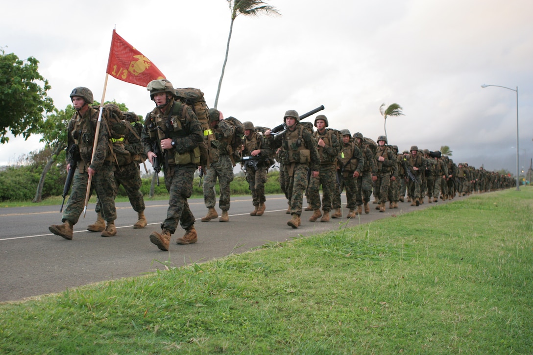 Capt. Jared Spurlock, (right), company commander, Charlie Company, 1/3, and a native of Pocatello, Idaho, leads his Marines from the front during a 15-mile hump aboard Marine Corps Base Hawaii, Kaneohe Bay, Nov. 4. 1/3 is currently undergoing sustainment training in preparation for their upcoming deployment to Afghanistan in support of Operation Enduring Freedom.