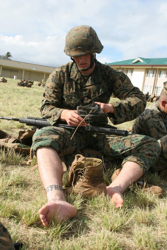 1/3 Marine begins to clean is weapon following a 15-mile hump aboard Marine Corps Base Hawaii, Kaneohe Bay, Nov. 4. 1/3 is currently undergoing sustainment training in preparation for their upcoming deployment to Afghanistan in support of Operation Enduring Freedom.