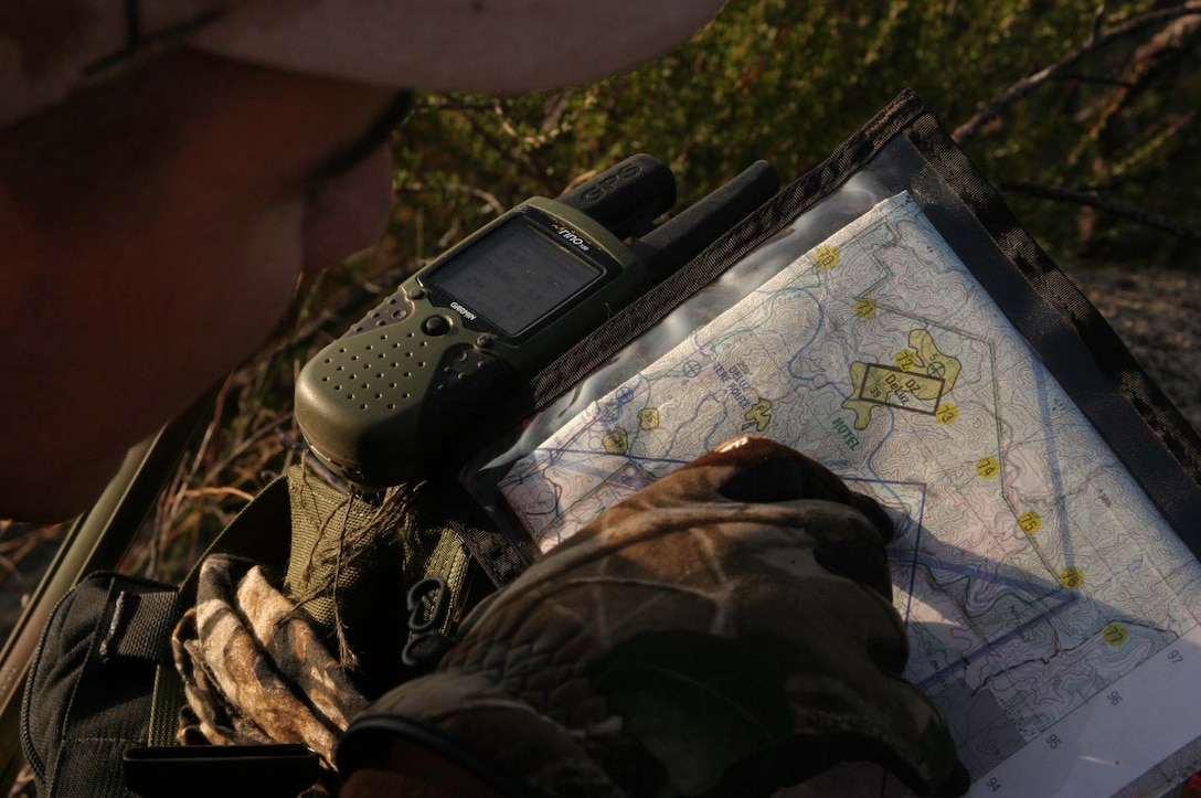 CAMP PENDLETON, Calif.(Nov. 5, 2005) - Sergeant Chris D. Washington checks his map during a morning deer hunt Nov. 5. Washington, 25, of Kilgore, Texas, was among several hunters who ended their hunting excursion empty handed. (Photo by: Cpl. Tom Sloan)