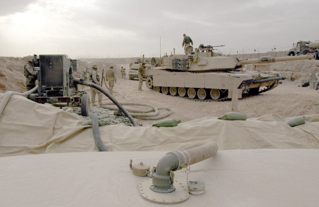 CAMP GANNON, Iraq--Marines serving with Combat Logistics Battalion-2, 2nd Marine Logistics Groups (Forward), distributing upward of 12, 000 gallons of fuel per day for various units participating in Operation Steel Curtain. (Official Marine Corps photo by Sgt. Josh H.  Hauser, captioned by 2nd Lt. Jorge O. Escatell) (released).