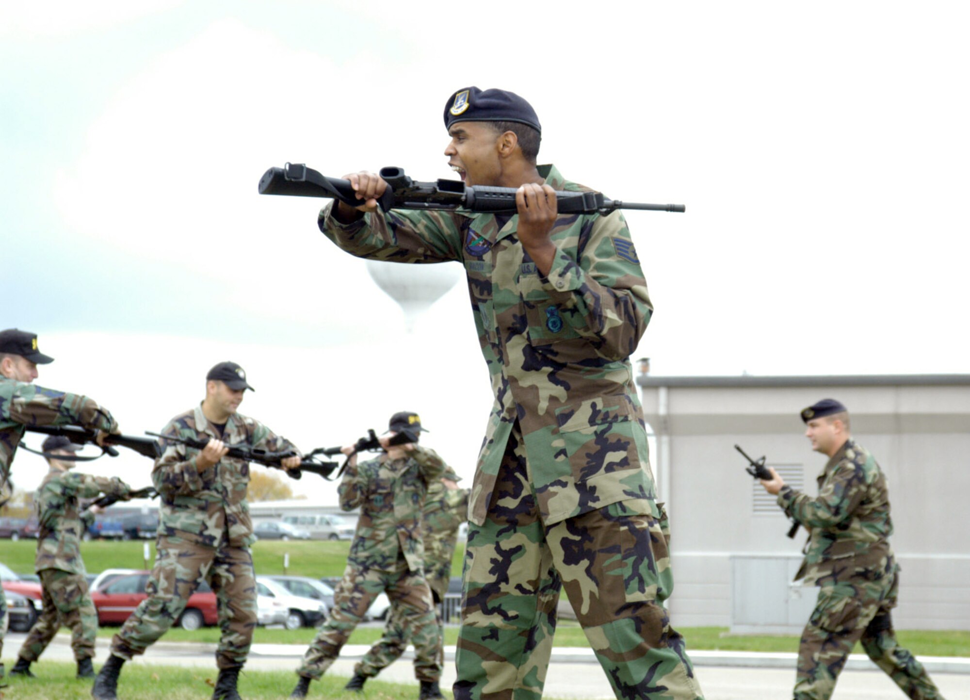 WRIGHT-PATTERSON AIR FORCE BASE, Ohio -- Staff Sgt. Lamar K. Bacon demonstrates rifle fighting maneuvers to 44 Airmen attending the air expeditionary combat skills training here. The new program prepares people for deployment. A total of 302 Wright-Patterson Airmen have attended the classroom training that began in October and ends later this month. Sergeant Bacon is a security forces troop with the 88th Security Forces Squadron. (U.S. Air Force photo by 2nd Lt. Kristy Rochon)