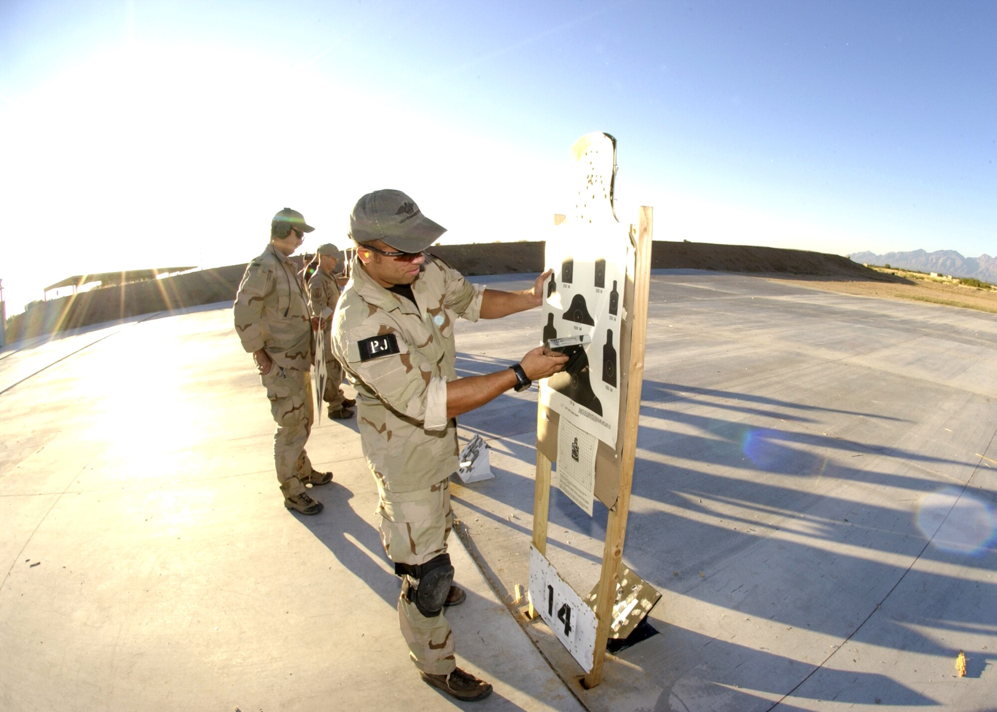 DAVIS-MONTHAN, Ariz. (AFPN) -- Tech. Sgt. Isiah Staley checks his target during training here.  He is from the 306th Rescue Squadron.  (U.S. Air Force photo by Airman 1st Class Veronica Pierce)