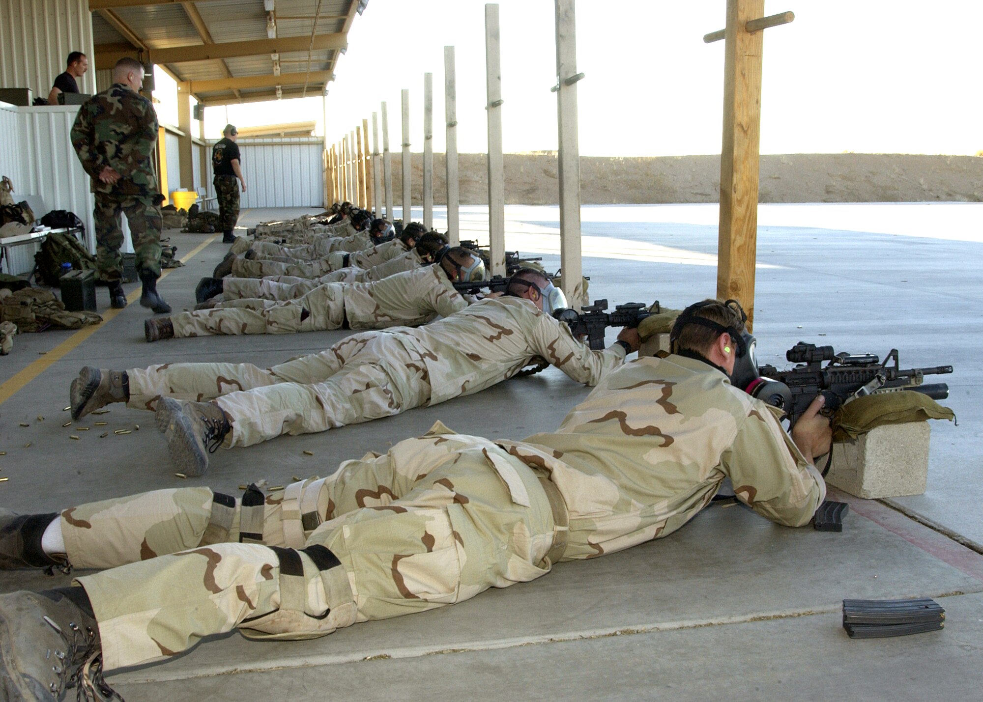DAVIS-MONTHAN, Ariz. (AFPN) -- Pararescue team members fires M-4 rifles equipped with grenade launchers and laser site during their annual training here.   The team is from the 306th Rescue Squadron.  (U.S. Air Force photo by Airman 1st Class Veronica Pierce)