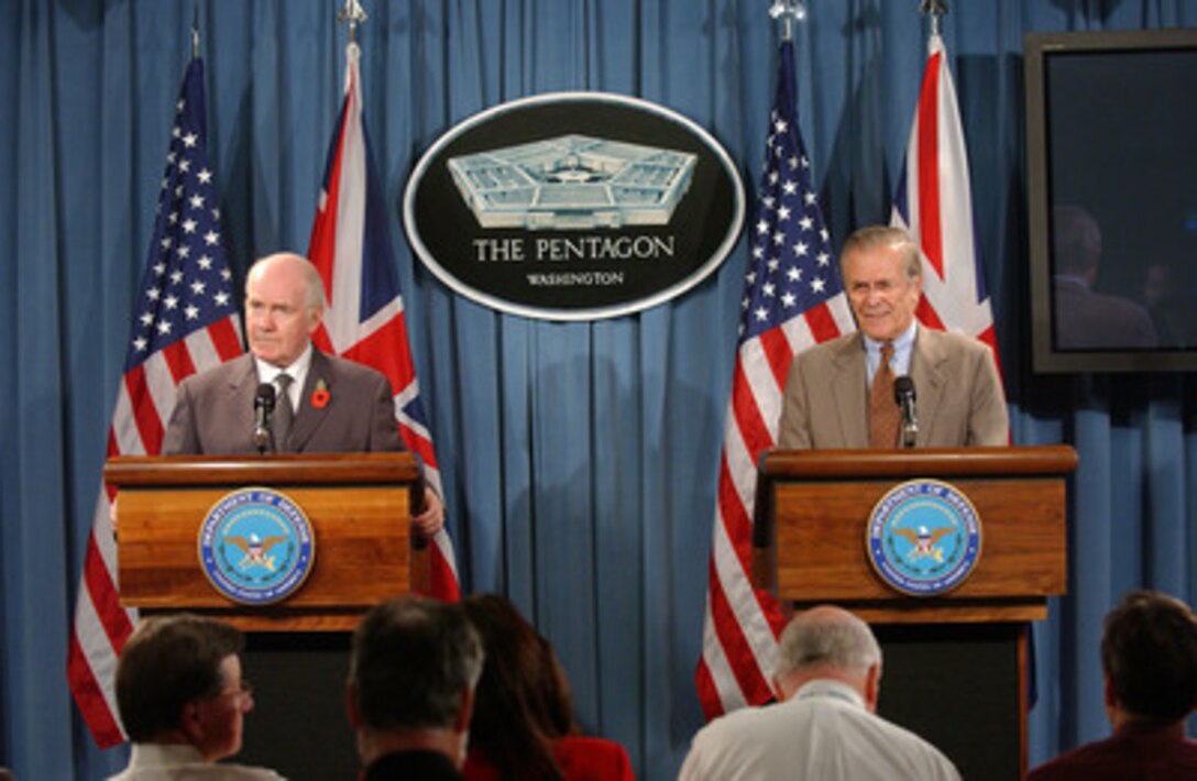 Secretary of Defense Donald H. Rumsfeld (right) answers a reporter's question during a joint press briefing with Secretary of State for Defense of the United Kingdom John Reid in the Pentagon on Nov. 7, 2005. Rumsfeld and Reid briefed reporters on their meeting and discussed current military operations in Iraq. 