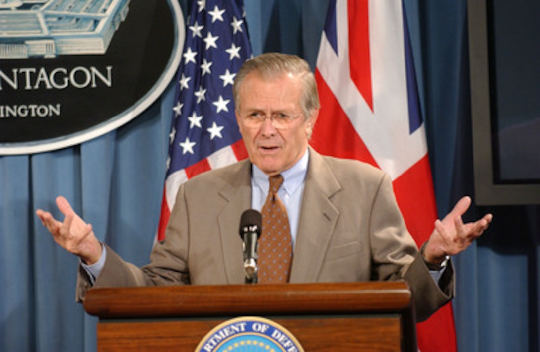 Secretary of Defense Donald H. Rumsfeld answers a reporter's question during a joint press briefing with Secretary of State for Defense of the United Kingdom John Reid in the Pentagon on Nov. 7, 2005. Rumsfeld and Reid briefed reporters on their meeting and discussed current military operations in Iraq. 