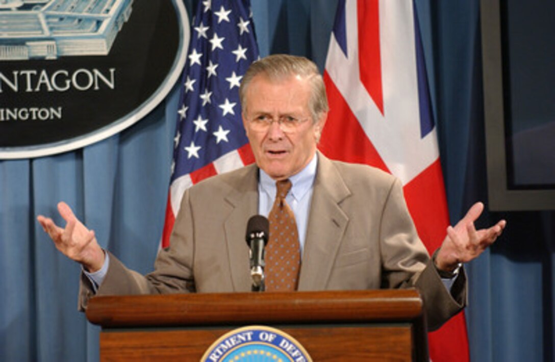 Secretary of Defense Donald H. Rumsfeld answers a reporter's question during a joint press briefing with Secretary of State for Defense of the United Kingdom John Reid in the Pentagon on Nov. 7, 2005. Rumsfeld and Reid briefed reporters on their meeting and discussed current military operations in Iraq. 