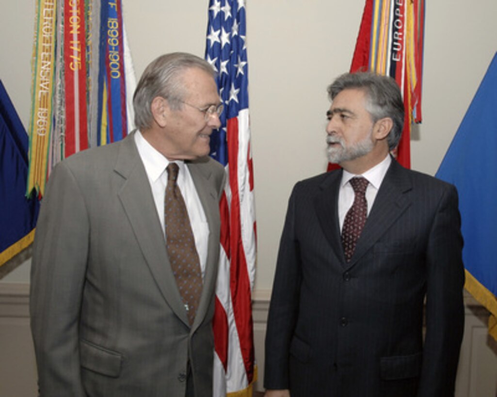 Secretary of Defense Donald H. Rumsfeld (left) chats with Portugal's Minister of Defense Luis Amado prior to their meeting in the Pentagon on Nov. 9, 2005. Rumsfeld and Amado are meeting to discuss defense issues of mutual interest. 