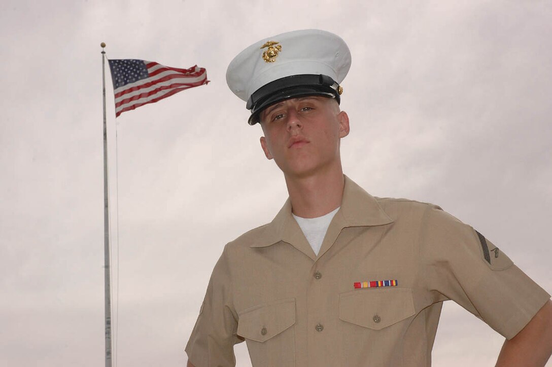 Lance Cpl. Alec D. Weck, Headquarters and Headquarters Squadron station adjutant clerk and native of Brick, N.J., stands outside of Building 980 where he works Dec. 19. Weck, a self described ?Marine Corps motivator,? is known among his peers and superiors as a Marine who always has positive contributions and a sense of humor that will often turn a bad day around. Weck has also contributed to the Desert Warrior, the station newspaper, in the form of commentaries relating to motivation and patriotism.