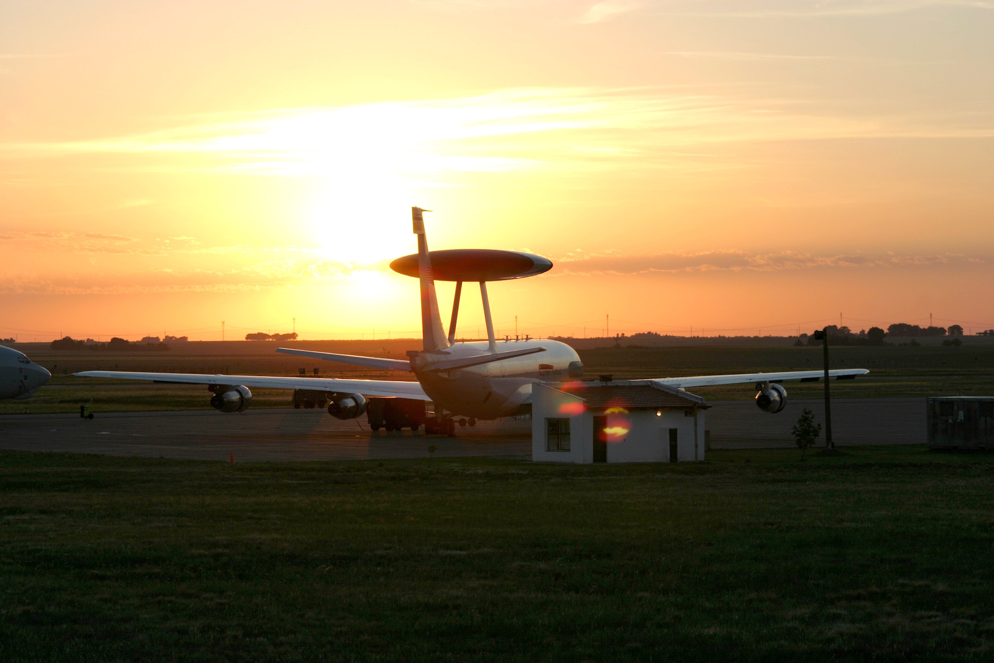 BASE AERONAVAL COMMANDANTE ESPORA, Argentina (AFPN) -- The sun rises over an E-3 Sentry airborne warning and control system aircraft here. Airmen from the 552nd Air Control Wing at Tinker Air Force Base, Okla., deployed to Argentina to provide airborne surveillance for the Summit of the Americas. President George Bush and 33 North and South American leaders convened to discuss solutions to common political, economic and social problems. (U.S. Air Force photo by 1st Lt. Corinna M. Jones)