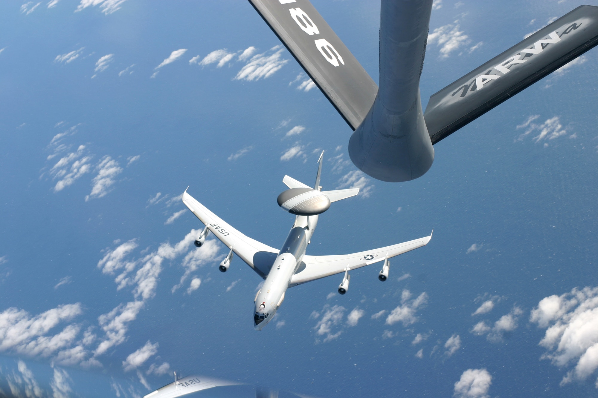 OVER ARGENTINA -- An E-3 Sentry airborne warning and control system aircraft breaks away from a Mississippi Air National Guard KC-135 Stratotanker during a presidential support mission here.  The Sentry, from the 552nd Air Control Wing at Tinker Air Force Base, Okla., deployed to provide airborne surveillance for the Summit.  (U.S. Air Force photo by 1st Lt. Corinna M. Jones)