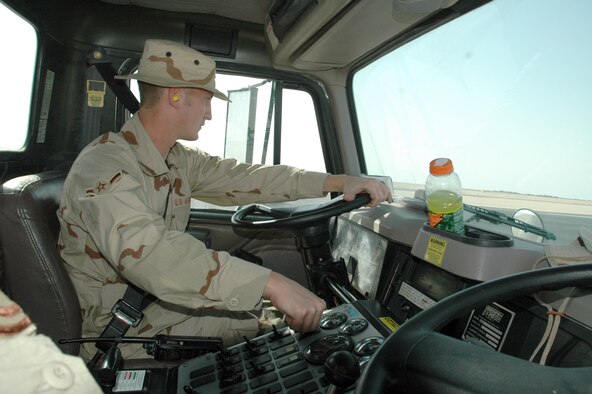SOUTHWEST ASIA (AFPN) -- Airman Joshua Lisowski drives along the flightline in an airfield sweeper ensuring all Foreign Object Damage debris is vacumed. Airman Lisowski is deployed from Eglin Air Force Base, Fla., and is part of the 379th Expeditionary Civil Engineer Squadron here. (U.S. Air Force photo by Master Sgt. Peter Borys)