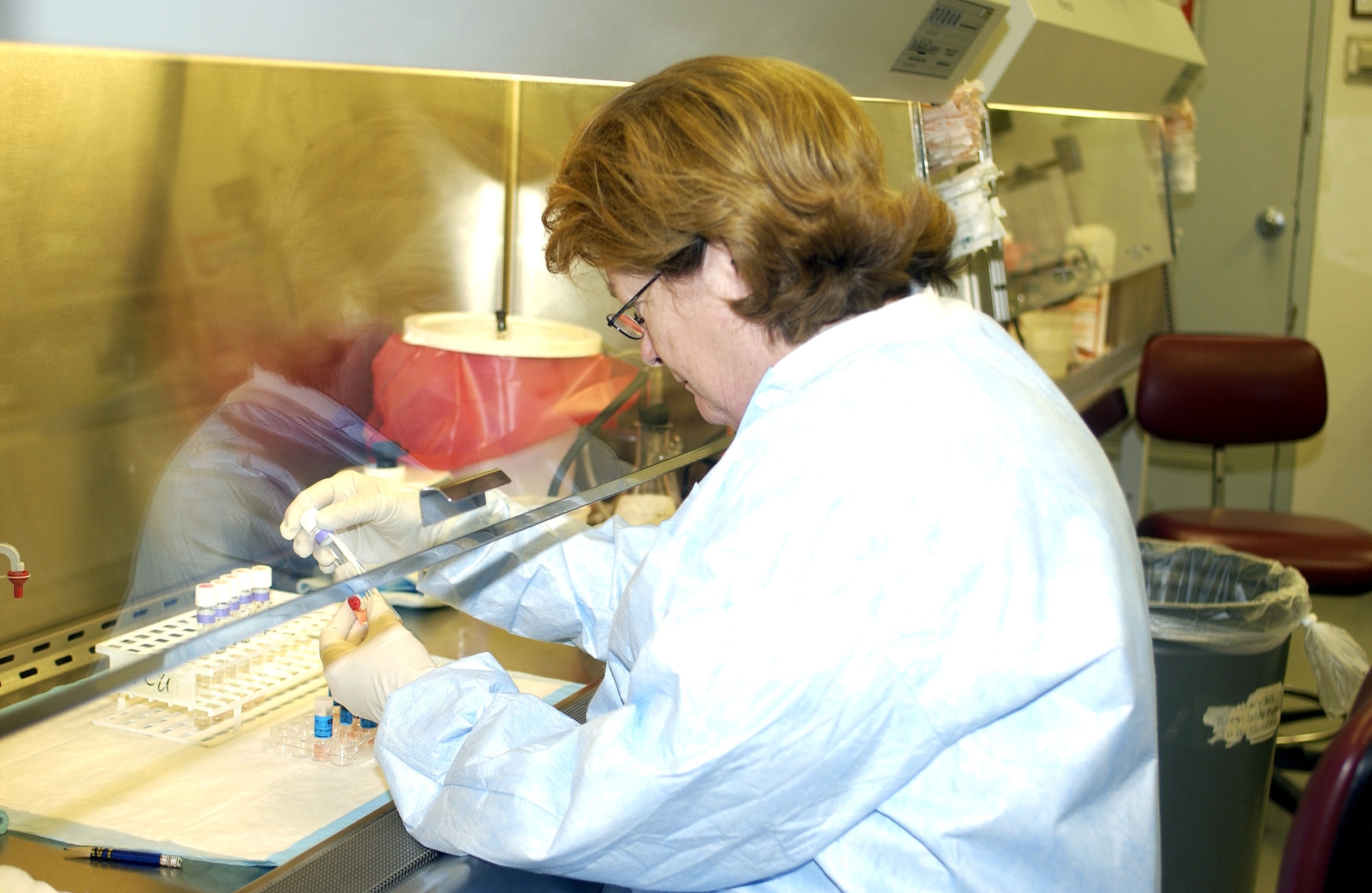 BROOKS CITY-BASE, Texas (AFPN) -- Lee Noel studies influenza strain samples. Mr. Noel is a technician at the Air Force Institute for Operational Health virology laboratory here. (U.S. Air Force photo by Tech. Sgt. Alfonso Ramirez)