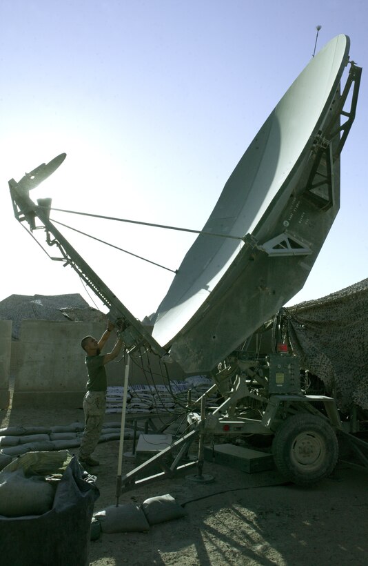 Combat engineers assigned to Combat Logistics Battalion 2, 2nd Marine Logistics Group (Forward), position a staircase they constructed to access a scout position at a forward operating base in the city of Husaybah, Iraq.