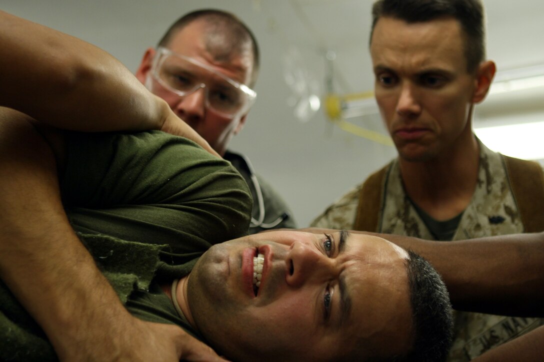 AL TAQADDUM, Iraq (Sept. 13, 2007) ? Lt. Cmdr. David W. Champ acts as a patient during a training exercise. Champ is among many other sailors who arrived to relieve the medical staff who had served since March. Champ serves the staff as an emergency physician.