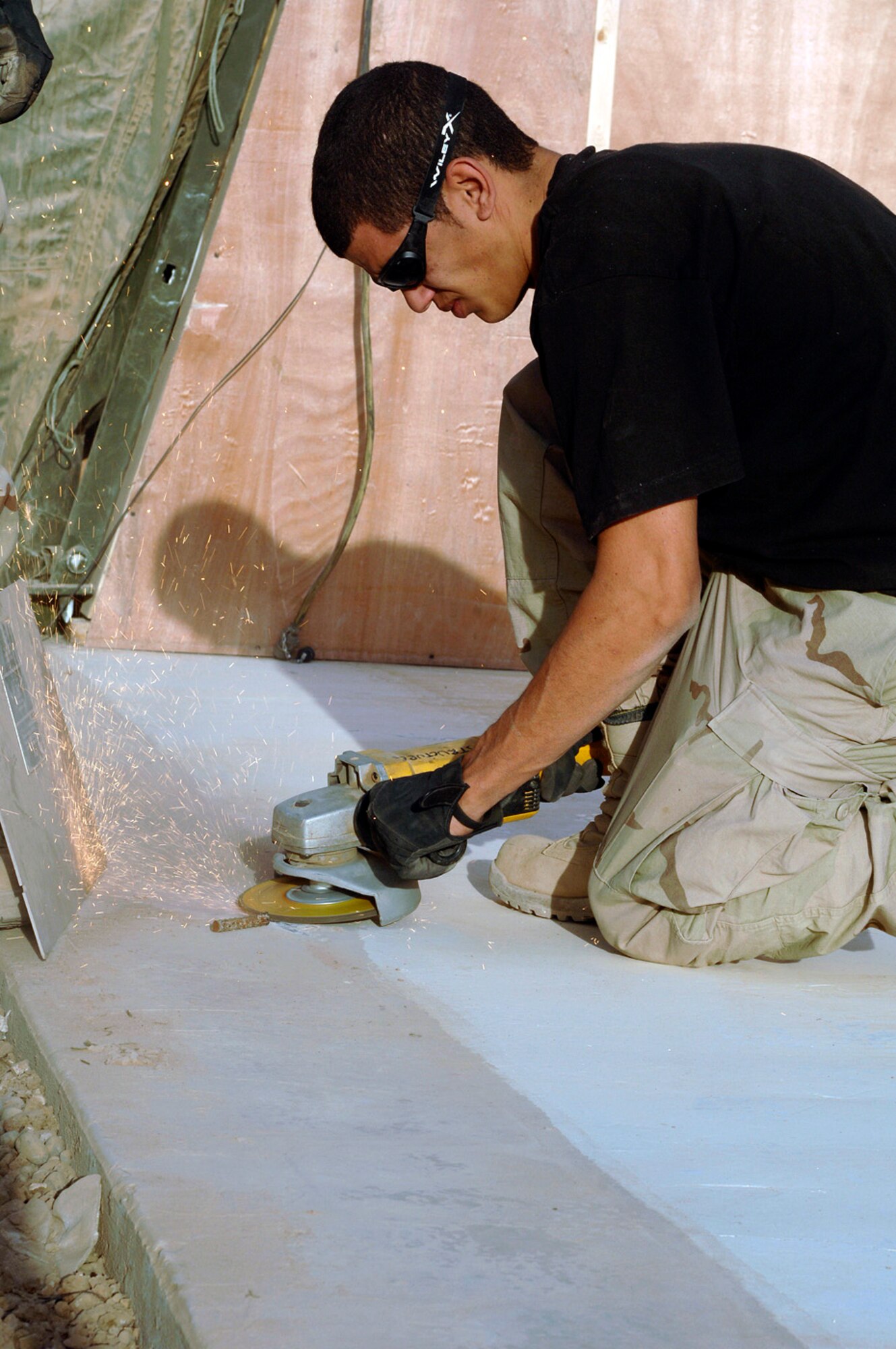 BALAD AIR BASE, Iraq -- Airman 1st Class Jeremie Wilson prepares a concrete pad during the renovations at the Air Force theater hospital here. Airman Wilson is with the 332nd Civil Engineering Squadron. (U.S. Air Force photo by Staff Sgt. Shannon Kluge) 