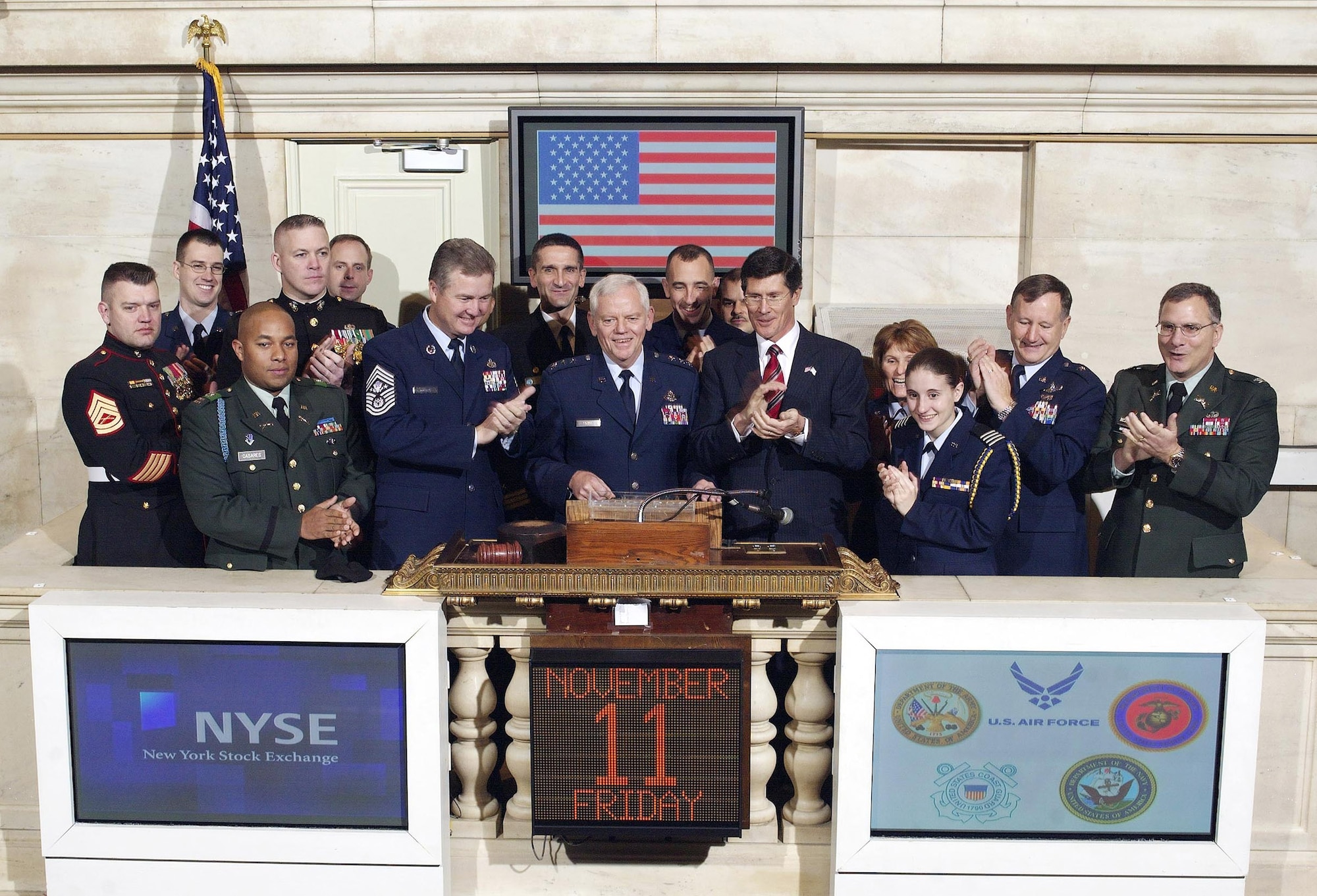 NEW YORK (AFPN) -- Lt. Gen. Arthur J. Lichte, Air Force assistant vice chief of staff (center), Chief Master Sergeant of the Air Force Gerald R. Murray (center left), and members of the armed forces ring the opening bell at the New York Stock Exchange. The group rang the bell Nov. 11 to commemorate the 87th anniversary of Veterans Day. (U.S. Air Force photo)