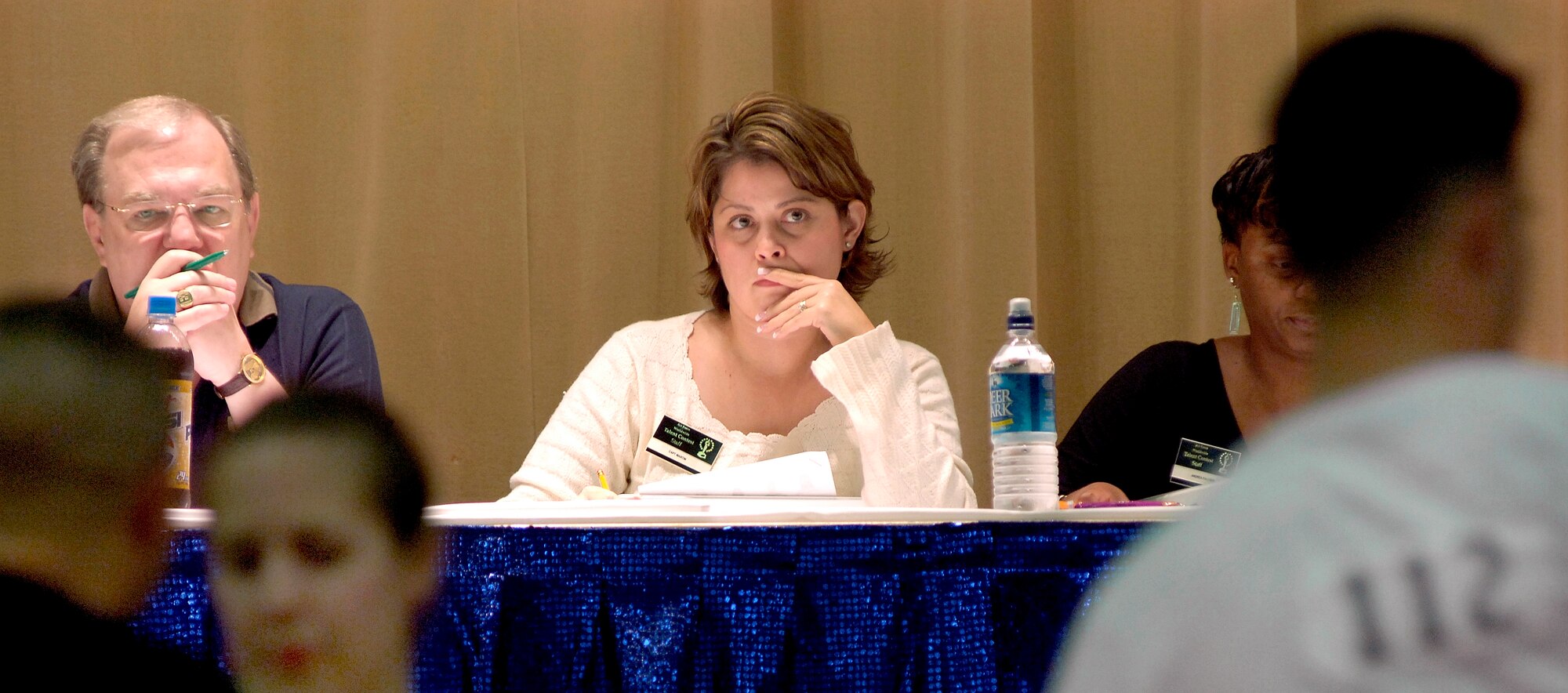 LACKLAND AIR FORCE BASE, Texas (AFPN) -- Tom Edwards, left, and Capt. Christina Martin judge the dance auditions in the 2006 Air Force Worldwide Talent Competition. More than 60 Airmen auditioned and practiced this week. The week ended with a live performance at the Worldwide Talent Contest. Along with trophies, they competed for a spot in the 2006 Tops In Blue tour. Mr. Edwards is the Tops In Blue director for Air Force Entertainment and Captain Martin is the Air Force Services Agency operations officer. (U.S. Air Force photo by Senior Airman Brian Ferguson)