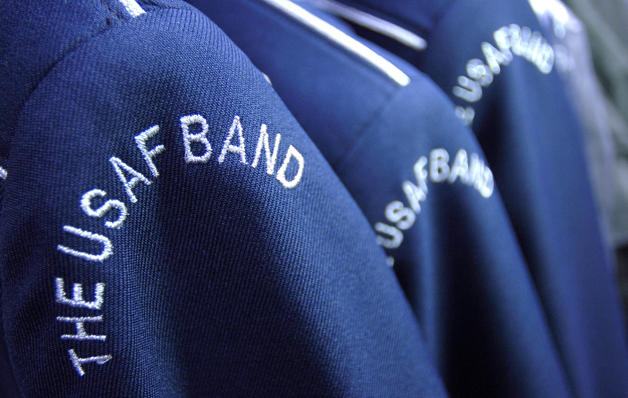 BOLLING AIR FORCE BASE, D.C. (AFPN) -- U.S. Air Force Band uniforms await the careful care they get from retired Senior Master Sgt. Juanita Williams. Ms. Williams volunteers her time once a week to help keep band members here looking their best for their many performances throughout the Washington, D.C. area and on their world travels. She was a part of the band for many years before her retirement in 1995. (U.S. Air Force photo by Master Sgt. Jim Varhegyi) 