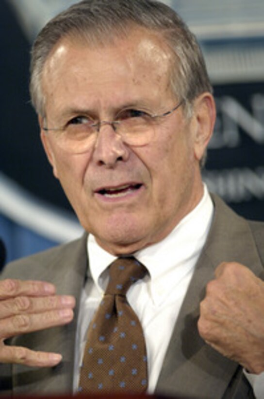 Secretary of Defense Donald H. Rumsfeld answers a reporter's question during a press briefing with Vice Chairman of the Joint Chiefs of Staff Adm. Edmund P. Giambastiani, U.S. Navy, in the Pentagon on Nov. 15, 2005. Rumsfeld and Giambastiani briefed reporters on the progress of operations in Iraq. 